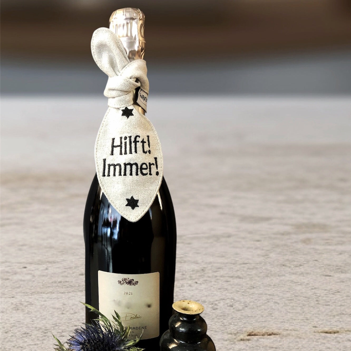 Bestickte Schleife mit  Botschaft